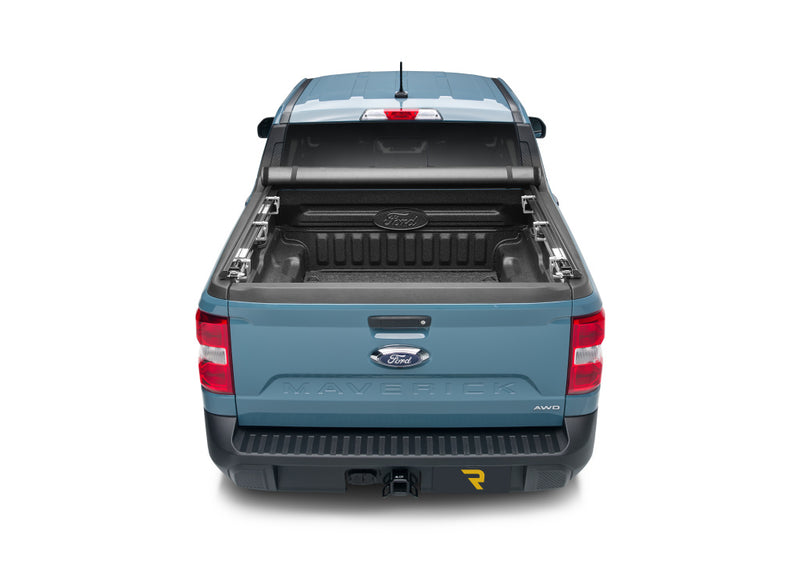 TruXedo TruXport soft roll-up tonneau cover rolled forward to the cab on a 2022-2024 Ford Maverick, straight rear view