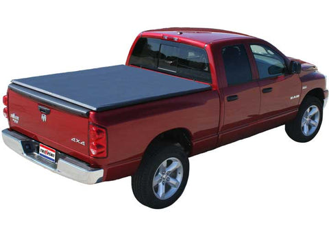 TruXedo TruXport soft roll-up tonneau cover closed over the bed of a pickup truck, widest view