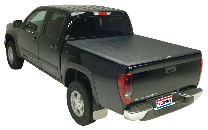 TruXedo TruXport soft roll-up tonneau cover closed over the bed of a pickup truck, widest view