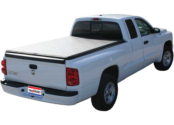 TruXedo TruXport soft roll-up tonneau cover closed over the bed of a pickup truck, rear three-quarter view