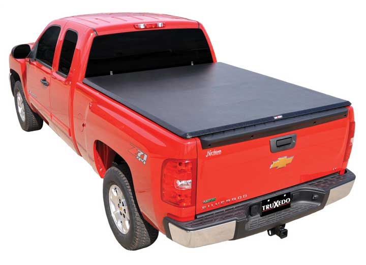 TruXedo TruXport soft roll-up tonneau cover closed over the bed of a pickup truck, rear three-quarter view