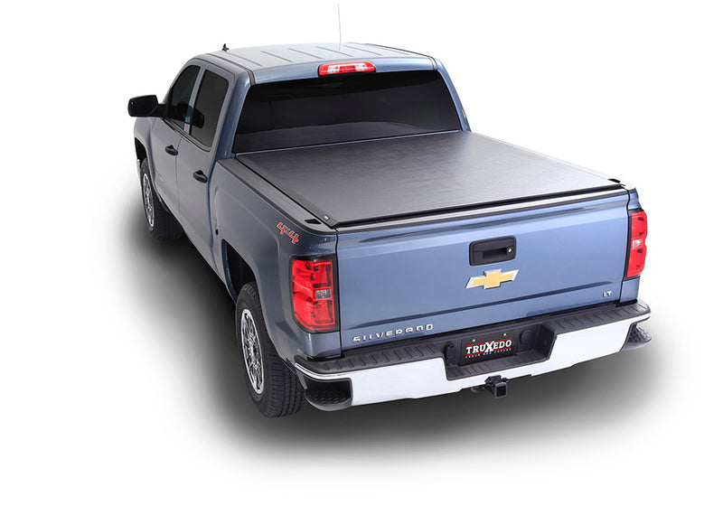 TruXedo TruXport soft roll-up tonneau cover closed over the bed of a pickup truck, high rear three-quarter view