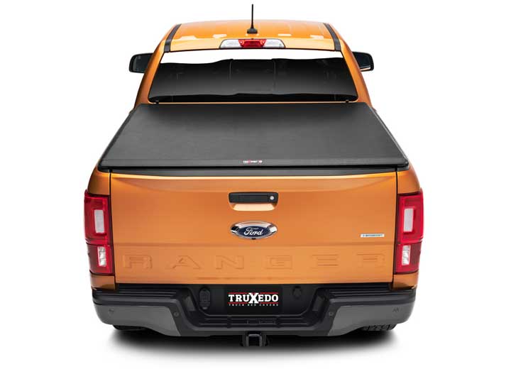 TruXedo TruXport soft roll-up tonneau cover closed over the bed of a pickup truck, straight rear view