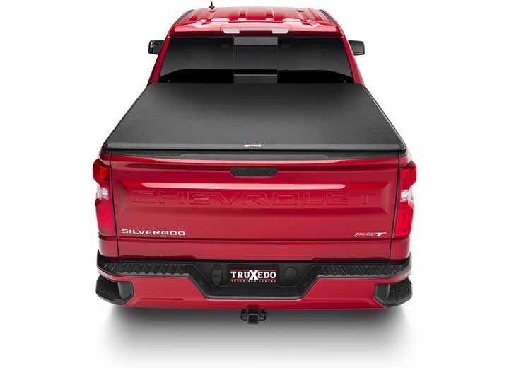 TruXedo TruXport soft roll-up tonneau cover closed over the bed of a pickup truck, straight rear view