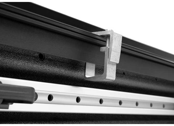 Close-up of the clamp hardware on a TruXedo TruXport soft roll-up tonneau cover