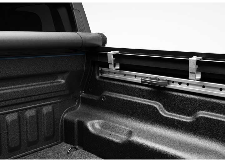Close-up of the header rail at the tailgate on a TruXedo TruXport soft roll-up tonneau cover