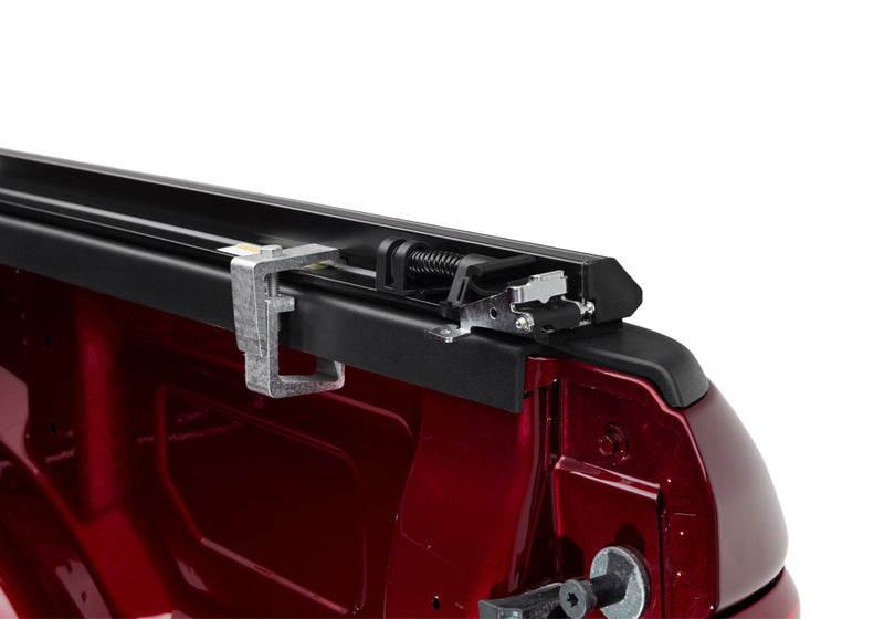 Close-up of the latch on the bed-rail clamp on a TruXedo TruXport soft roll-up tonneau cover