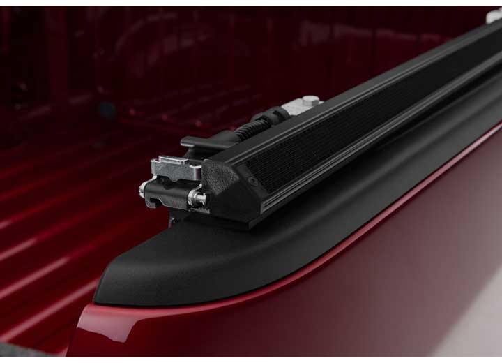 Close-up of the latch where the cover meets the side rail on a TruXedo TruXport soft roll-up tonneau cover