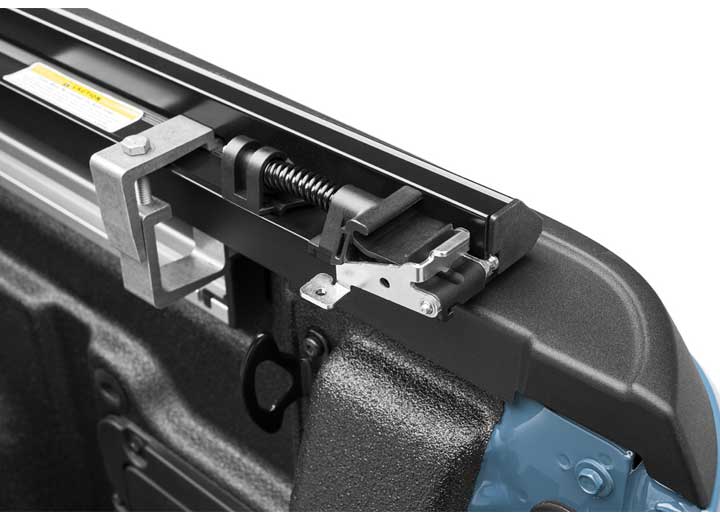 Close-up of the latch and tensioning mechanism on a TruXedo TruXport soft roll-up tonneau cover
