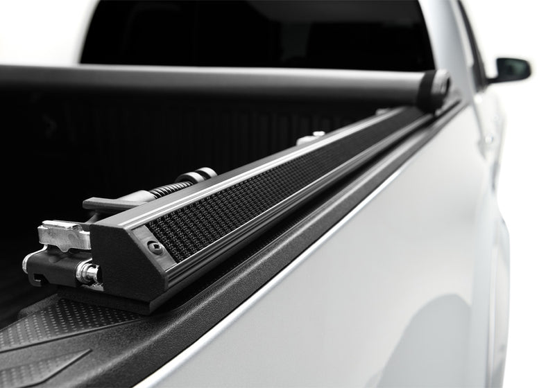 Close-up of the outer face of the side rail on a TruXedo TruXport soft roll-up tonneau cover