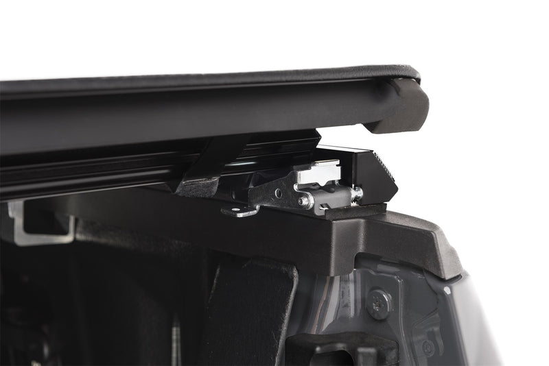 Close-up of the release lever at the rear corner on a TruXedo TruXport soft roll-up tonneau cover