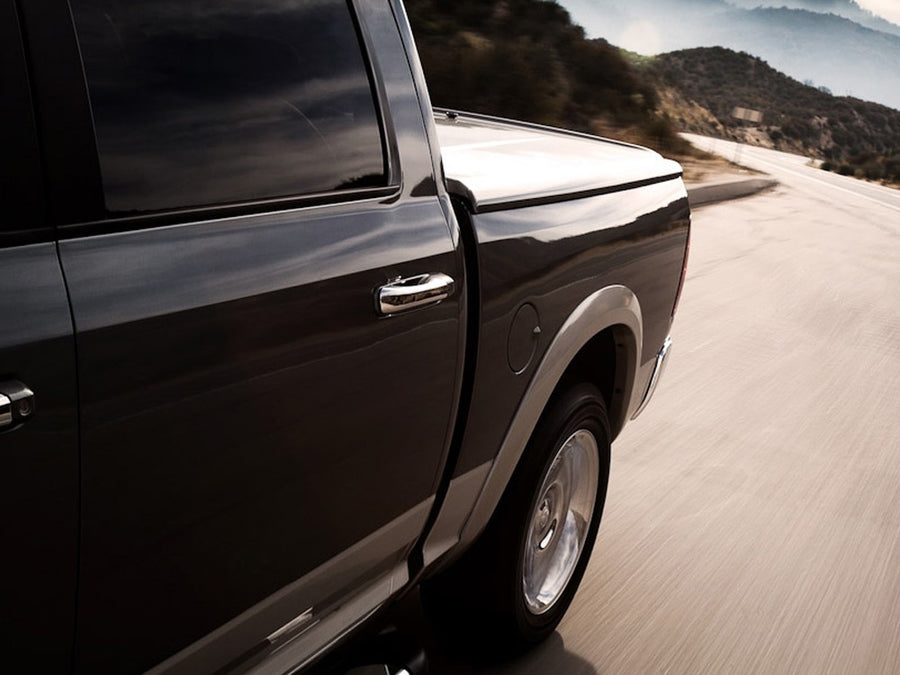 UnderCover LUX one-piece tonneau cover closed and sealed over a loaded pickup bed