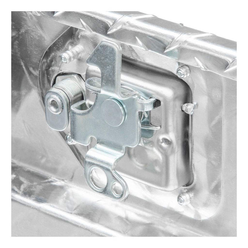 Close detail of the internal latch and linkage hardware behind the handle on the UWS 48" Passenger-Side Wheel Well Truck Tool Box with Drawers, Bright Aluminum