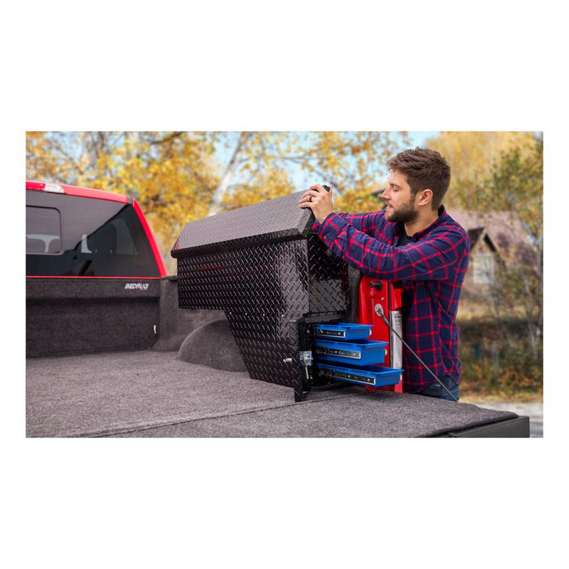 UWS 48" Passenger-Side Wheel Well Truck Tool Box with Drawers, Gloss Black in a truck bed with the lid raised and the drawer bay open