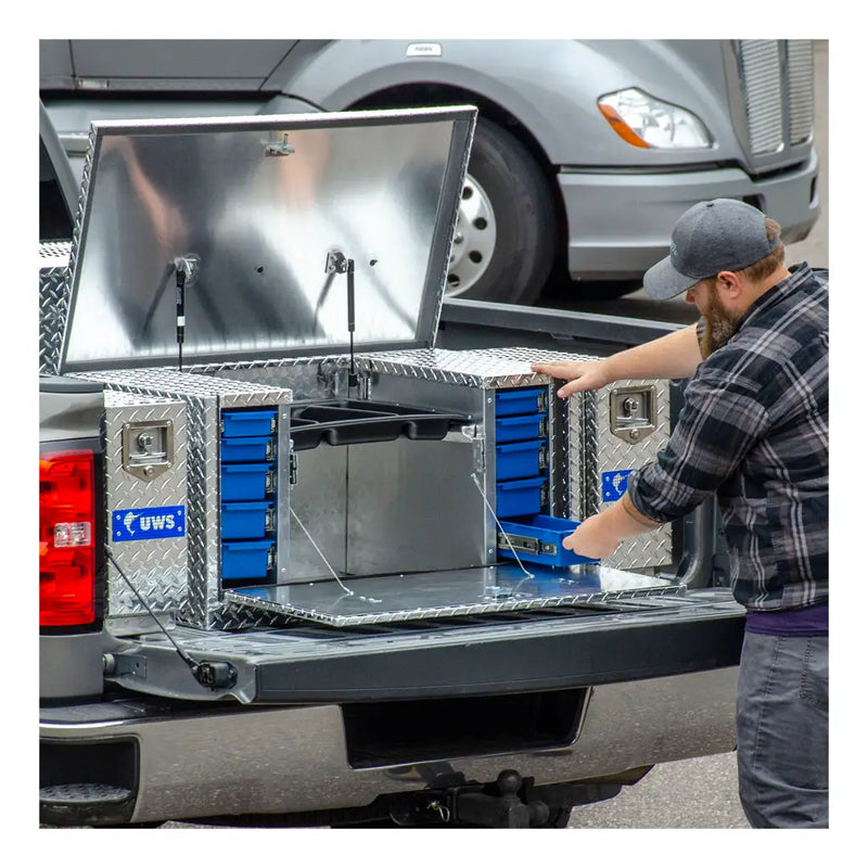 Owner loading the drawer units from the open lid