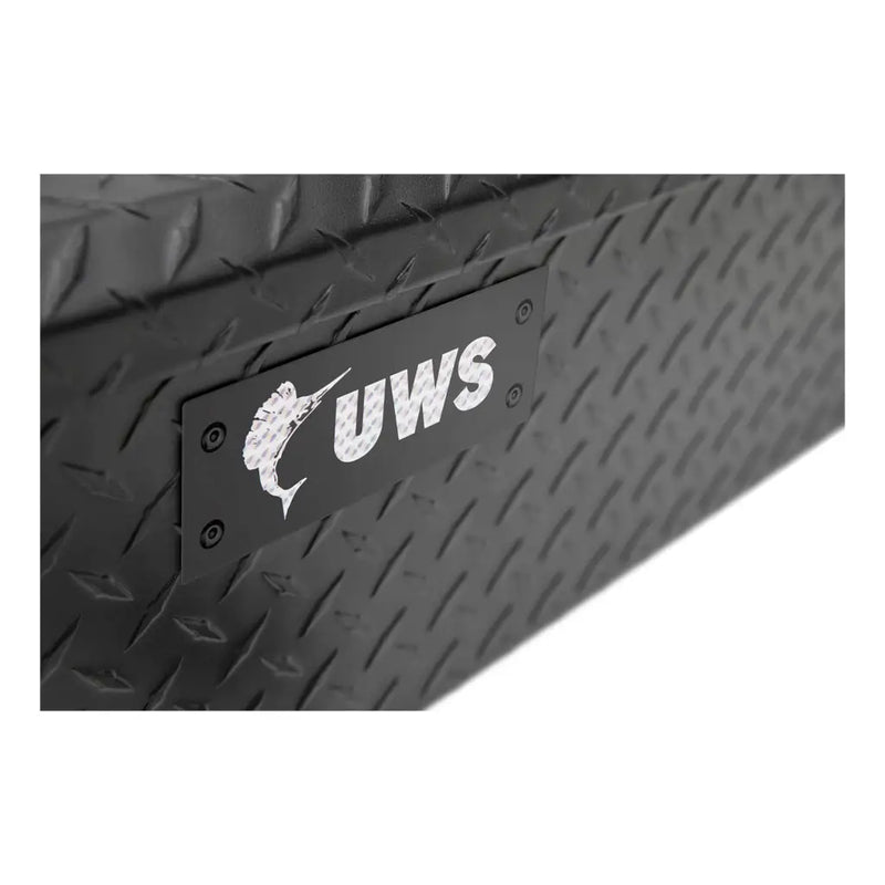 Macro of the embossed UWS marlin logo on the box side