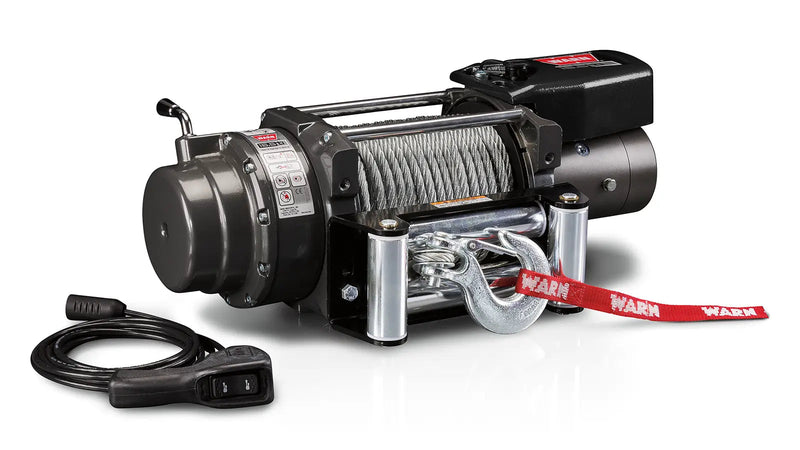 Warn 16.5ti winch, three-quarter view on white, showing the free-spool clutch lever, wire rope on the drum, roller fairlead and the wired thermometric remote