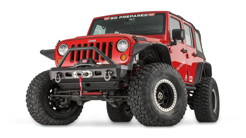 Warn Elite Stubby Front Bumper with Grille Guard Tube for 2007-2017 Jeep Wrangler / 2018 Jeep Wrangler JK, low-angle view on the red Jeep Wrangler JK