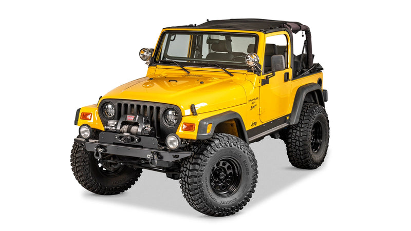 Warn Rock Crawler Front Full Width Bumper for 1997-2006 Jeep Wrangler, installed on a yellow Jeep Wrangler TJ, winch sold separately