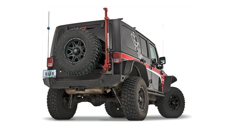 Warn Elite Rear Bumper for 2007-2017 Jeep Wrangler, on a Jeep Wrangler JK, shown with a tire carrier and Hi-Lift jack mount (sold separately)