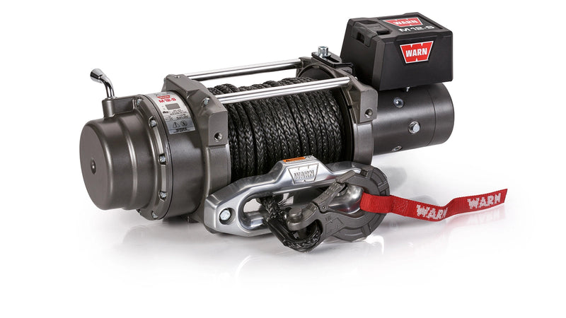 Warn M12-S winch, three-quarter view on white, showing the free-spool clutch lever, synthetic rope on the drum, aluminum hawse fairlead and alloy hook