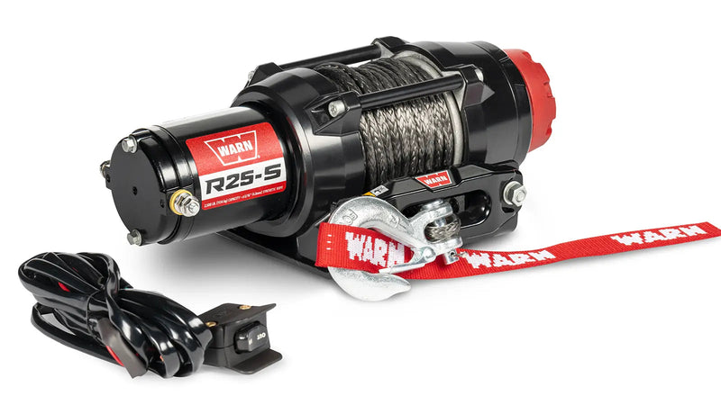 Warn R25-S powersports winch, three-quarter view on white, shown with the handlebar-mounted rocker switch supplied with it
