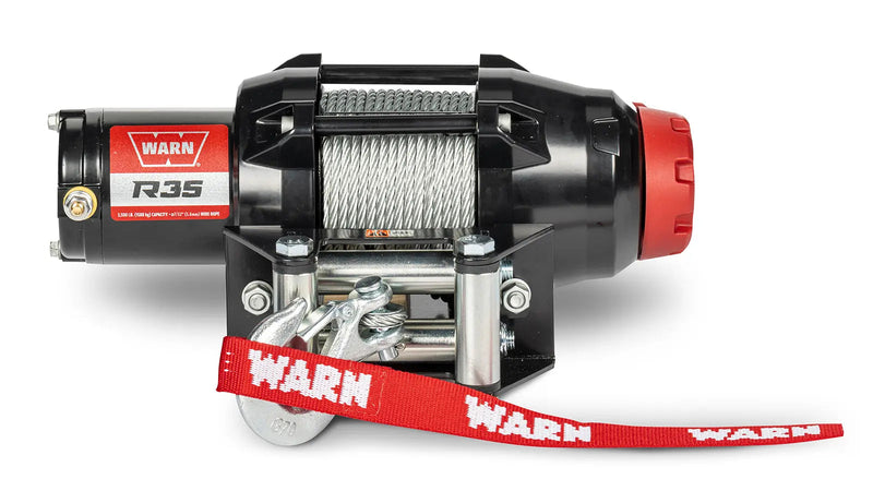Warn R35 powersports winch, front elevation on white, showing steel wire rope on the drum, the roller fairlead and the hook with its red Warn strap