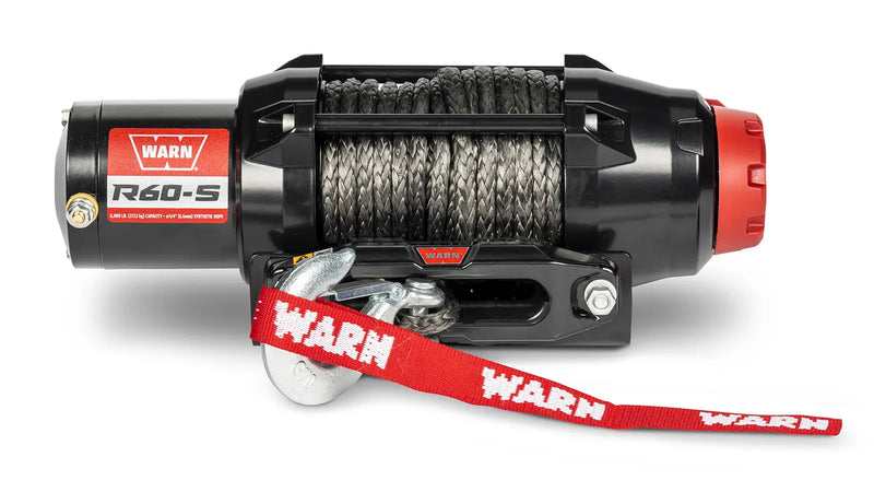 Warn R60-S powersports winch, front elevation on white, showing synthetic rope on the drum, the hawse fairlead and the hook with its red Warn strap