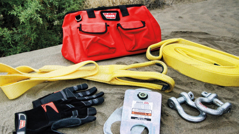 Warn Medium Duty Recovery Kit laid out on the trail with its carry bag