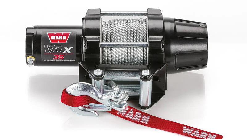 Warn VRX 35 powersports winch, front elevation on white, showing steel wire rope on the drum, the roller fairlead and the hook with its red Warn strap