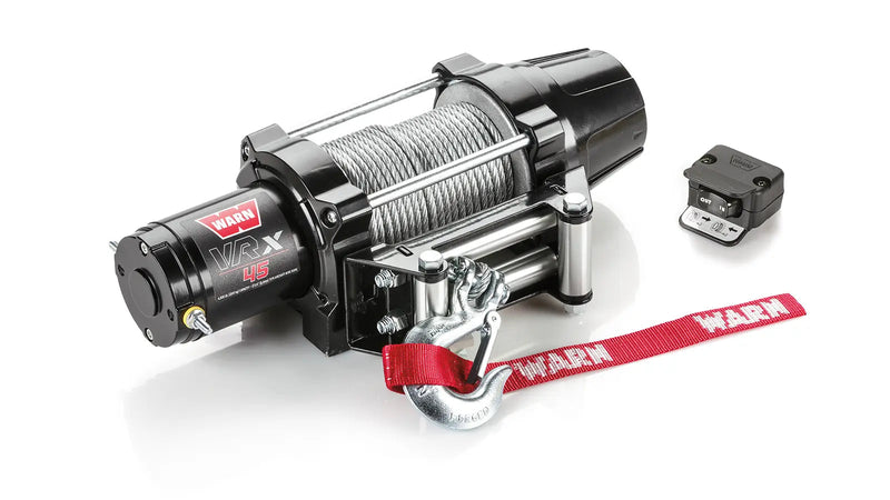 Warn VRX 45 powersports winch, three-quarter view on white, shown with the dash-mounted rocker control switch and corded remote supplied with it