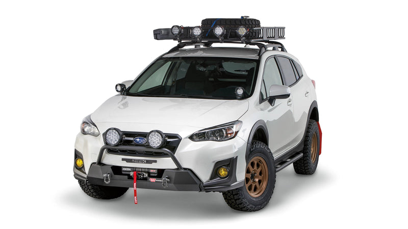 Warn Semi-Hidden Winch Mount and Grille Guard Tube on a 2018-2023 Subaru Crosstrek, alternate view with lights fitted
