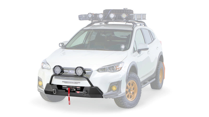Warn Semi-Hidden Winch Mount and Grille Guard Tube on a 2018-2023 Subaru Crosstrek, ghost view with the vehicle faded out and lights fitted