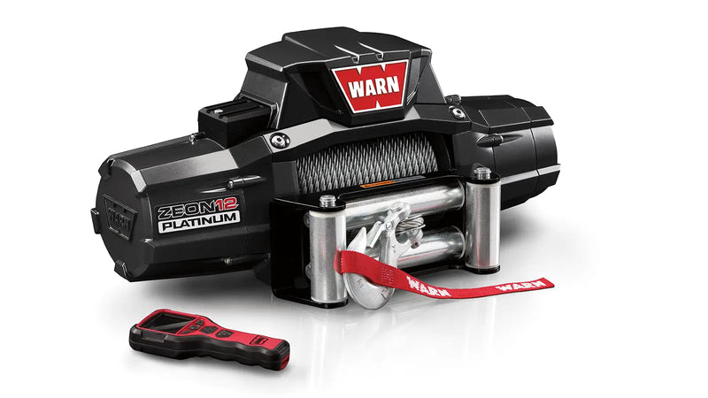 Warn ZEON Platinum 12 Winch with steel wire rope, angled view with remote