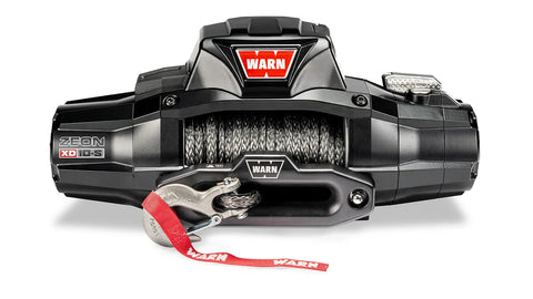 Warn ZEON XD 10-S winch, front three-quarter studio view with Spydura synthetic rope spooled and the red hook strap fitted