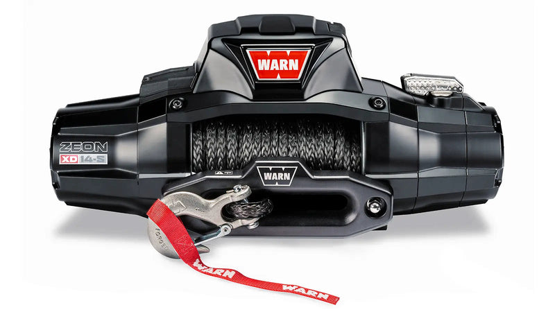 Warn ZEON XD 14-S winch, front three-quarter studio view with Spydura Pro synthetic rope spooled and the red hook strap fitted