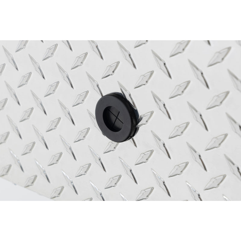 Weather Guard 114-0-04 gull-wing crossover box in bright aluminum diamond plate, close-up of the 12 volt power pass access port grommet