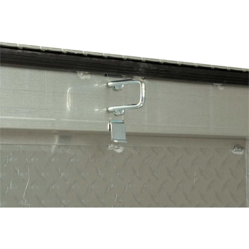 Weather Guard 117-0-04 crossover saddle box in bright aluminum diamond plate, close-up of the latch striker plate