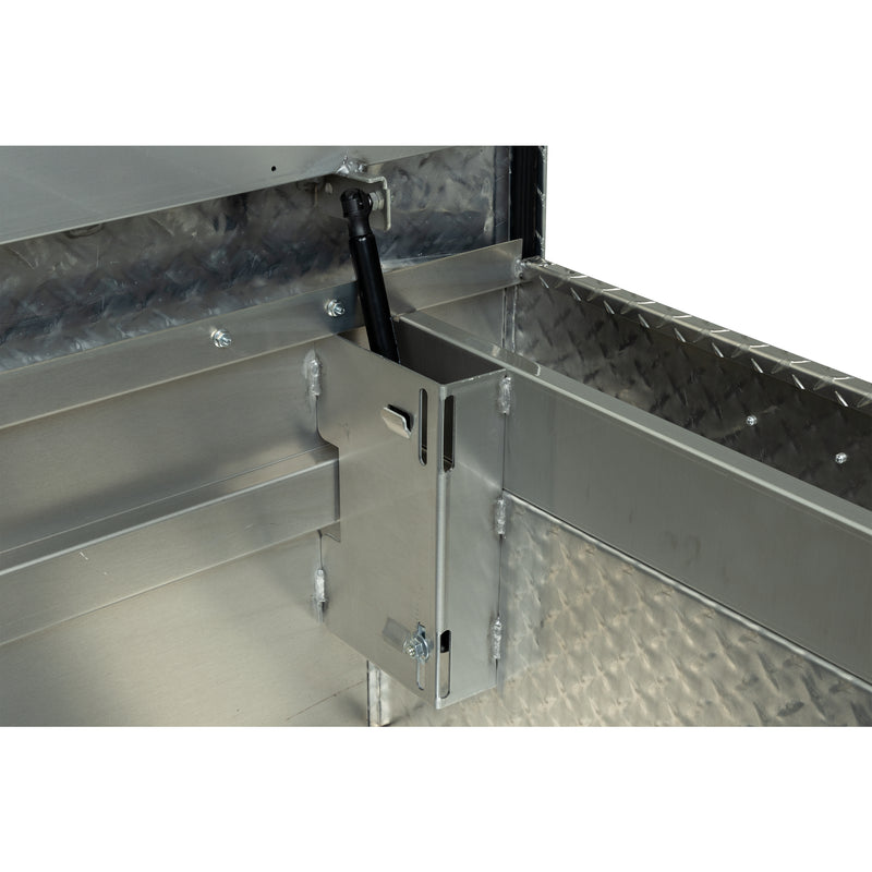 Weather Guard 117-0-04 crossover saddle box in bright aluminum diamond plate, close-up of the welded gas strut shield inside the body