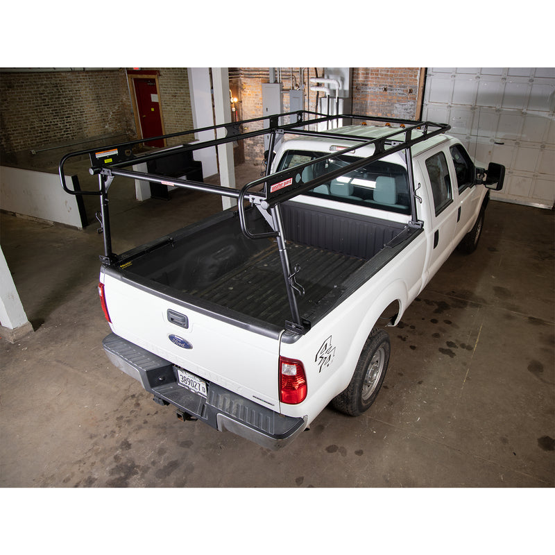 Heavy-duty Weather Guard steel truck rack fitted to a white pickup, rear three-quarter view