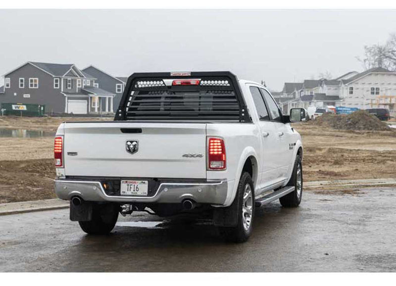 Rear view of a white Ram pickup at a jobsite with the Weather Guard louvered headache rack fitted