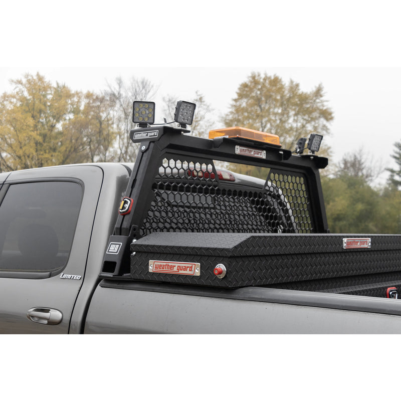 Weather Guard hex headache rack and a black crossover toolbox fitted to a silver Toyota Tundra