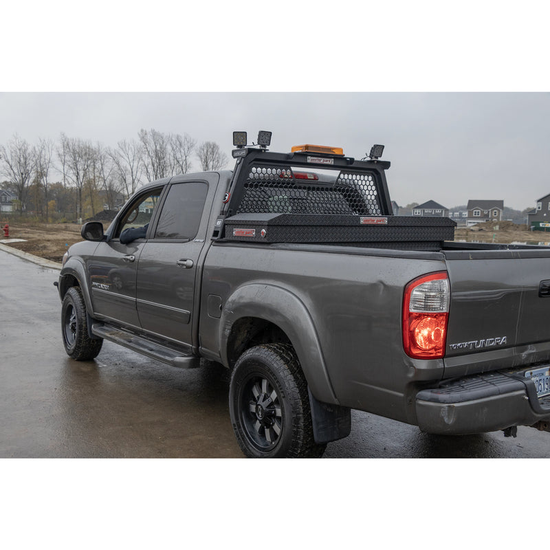 Full side profile of a silver Toyota Tundra with the Weather Guard hex headache rack and toolbox