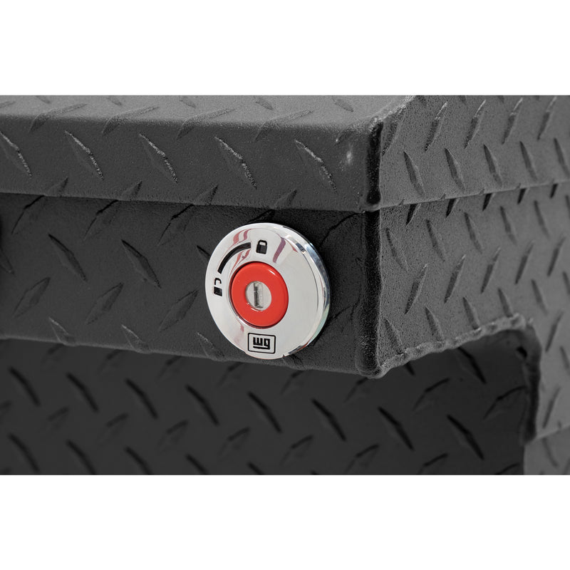 Weather Guard 121-52-04 crossover saddle box in textured matte black, close-up of the red push-button lock and Weather Guard badge