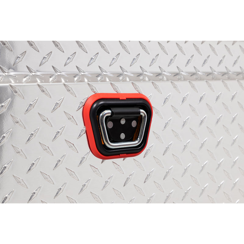Weather Guard 123-0-04 crossover saddle box in bright aluminum diamond plate, close-up of the reinforced tie-down buckle on the body