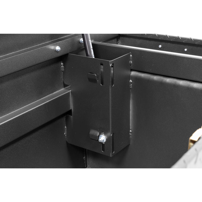 Weather Guard 123-52-04 crossover saddle box in textured matte black, close-up of the welded gas strut shield inside the body