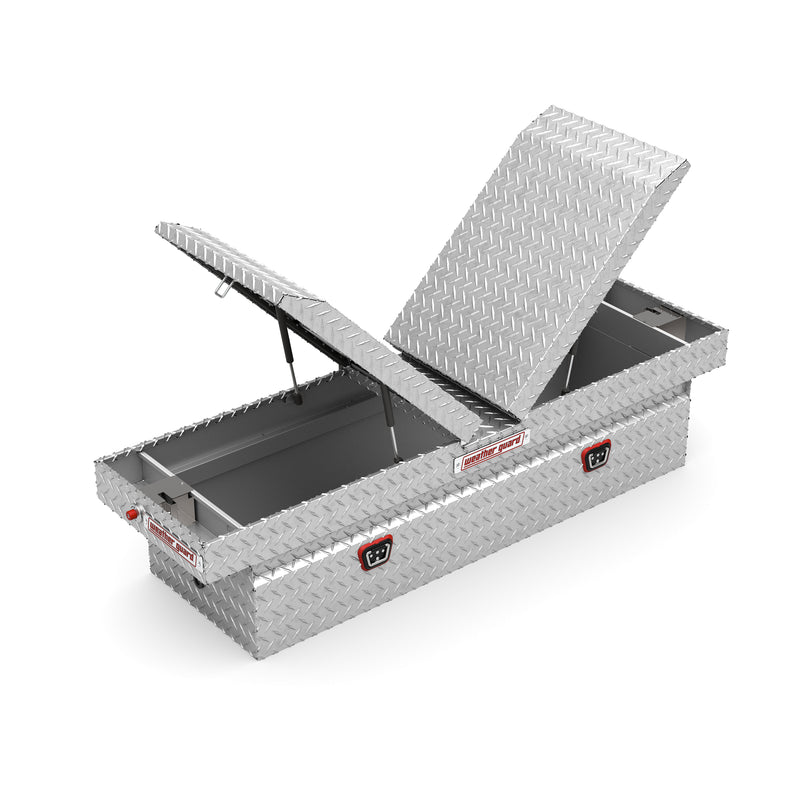 Weather Guard 124-0-04 gull-wing crossover box in bright aluminum diamond plate, one lid raised on its gas strut, showing the interior and the center divider