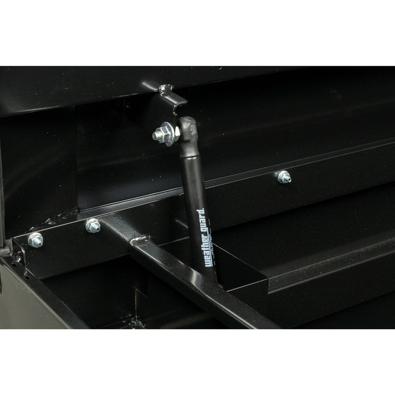 Weather Guard 126-5-04 crossover saddle box in gloss black, close-up of the gas strut holding the lid open