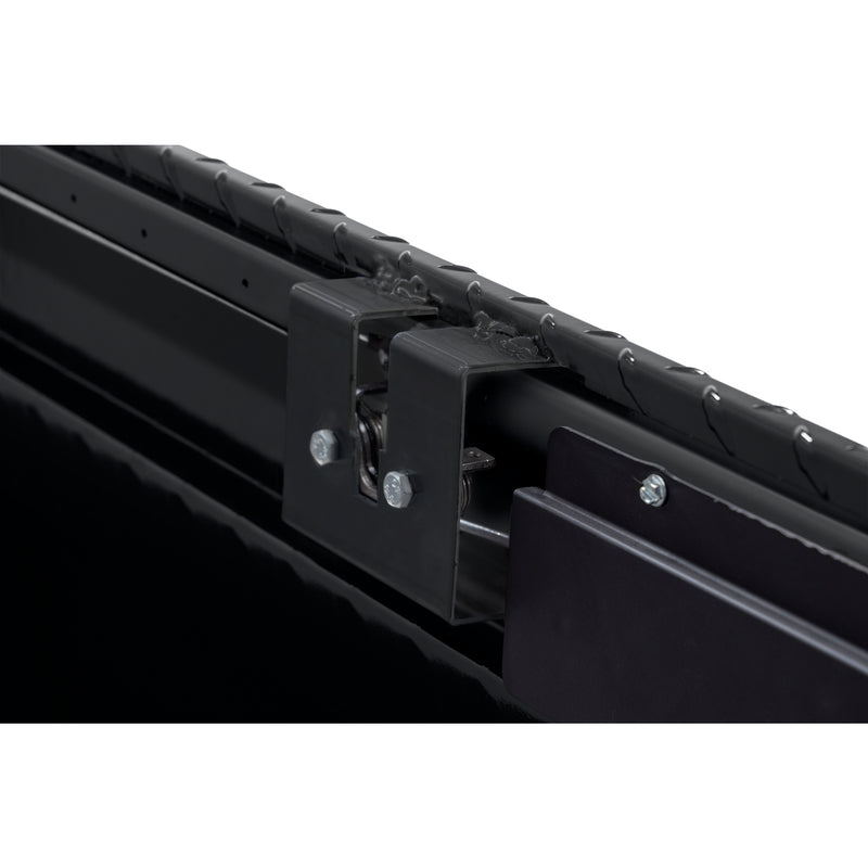 Weather Guard 127-5-04 crossover saddle box in gloss black, close-up of the rotary latch and locking mechanism inside the body