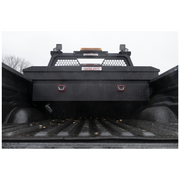 Weather Guard 127-52-04 matte black crossover box mounted across the bed rails behind the cab of a full-size truck, shown with a headache rack